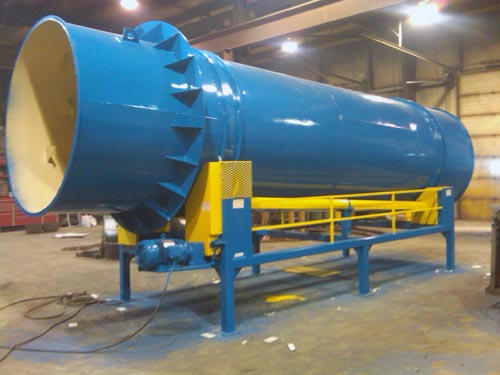 Professional industrial welder welding metal parts in metalworking factory