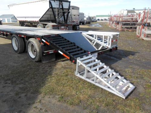 Professional industrial welder welding metal parts in metalworking factory