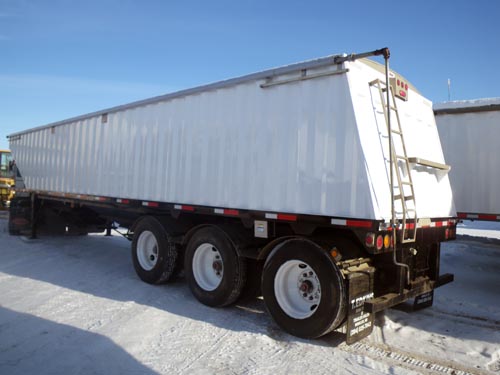 Professional industrial welder welding metal parts in metalworking factory