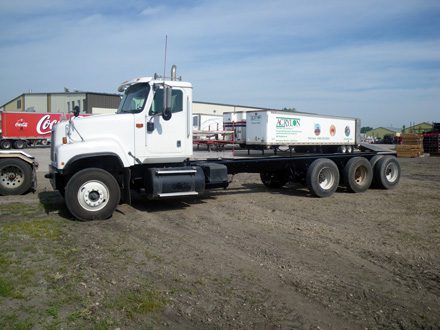 Professional industrial welder welding metal parts in metalworking factory